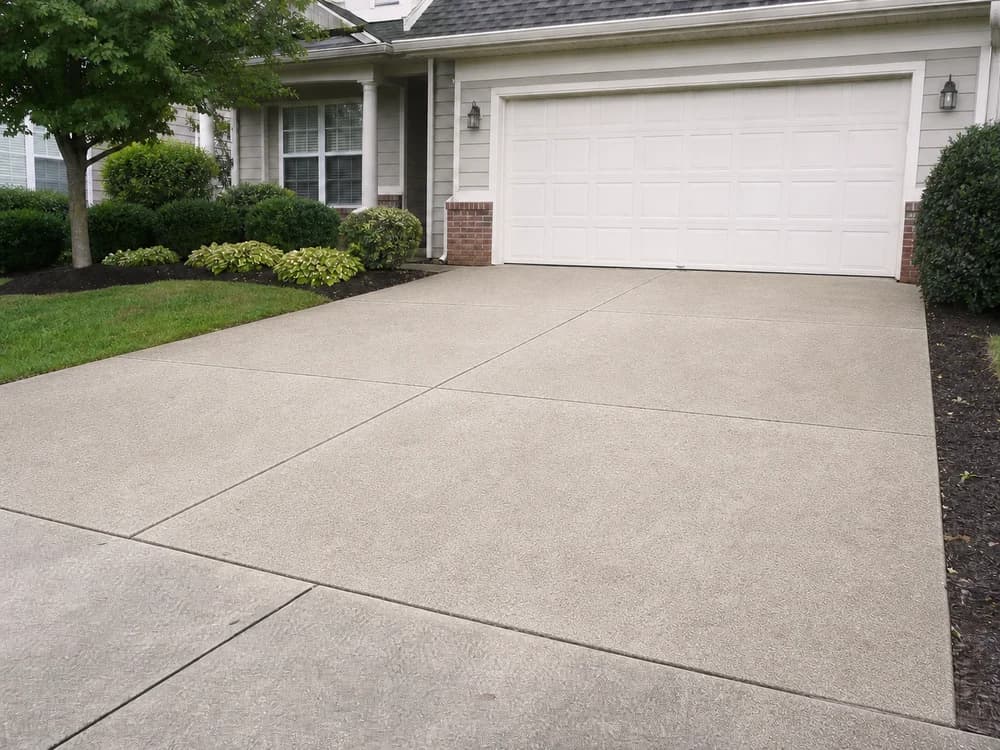 The same driveway bright and clean after professional pressure washing